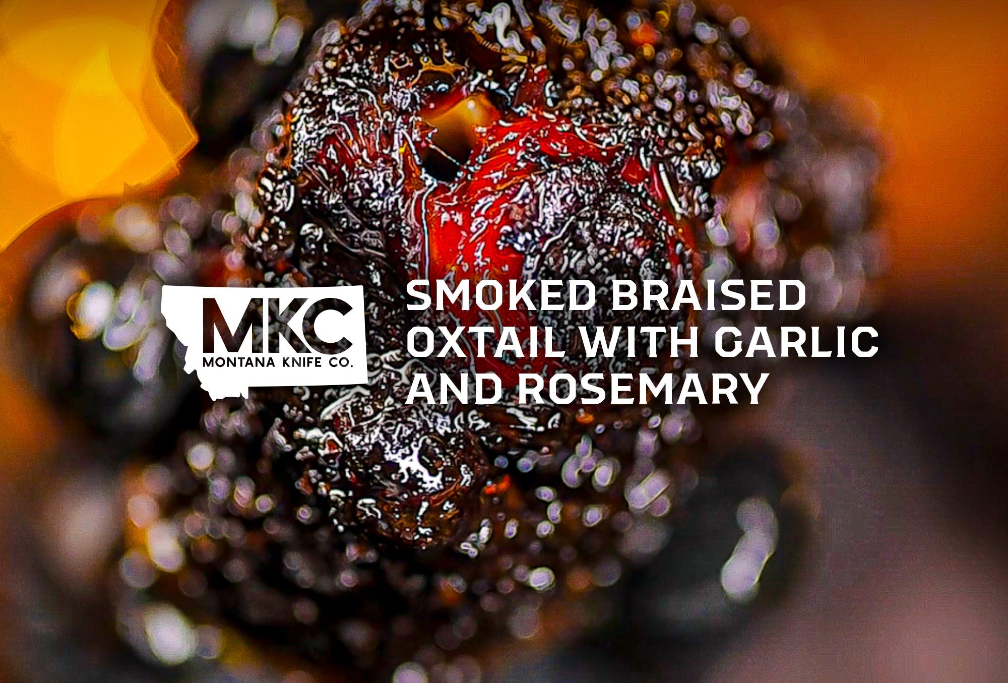 Close-up of smoked braised oxtail with garlic and rosemary.