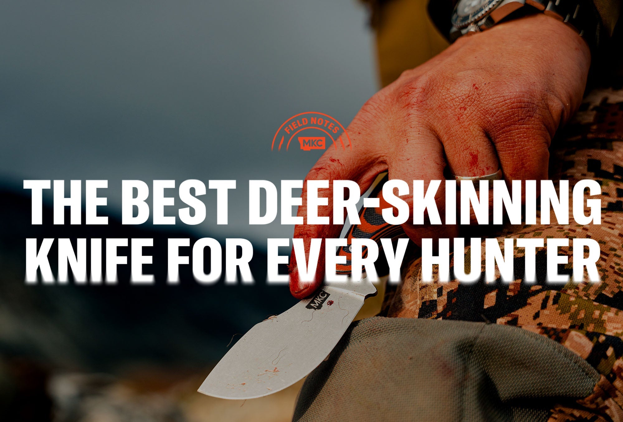 Hunter holding a knife with a bloodied hand, illustrating the use of a deer skinning knife.