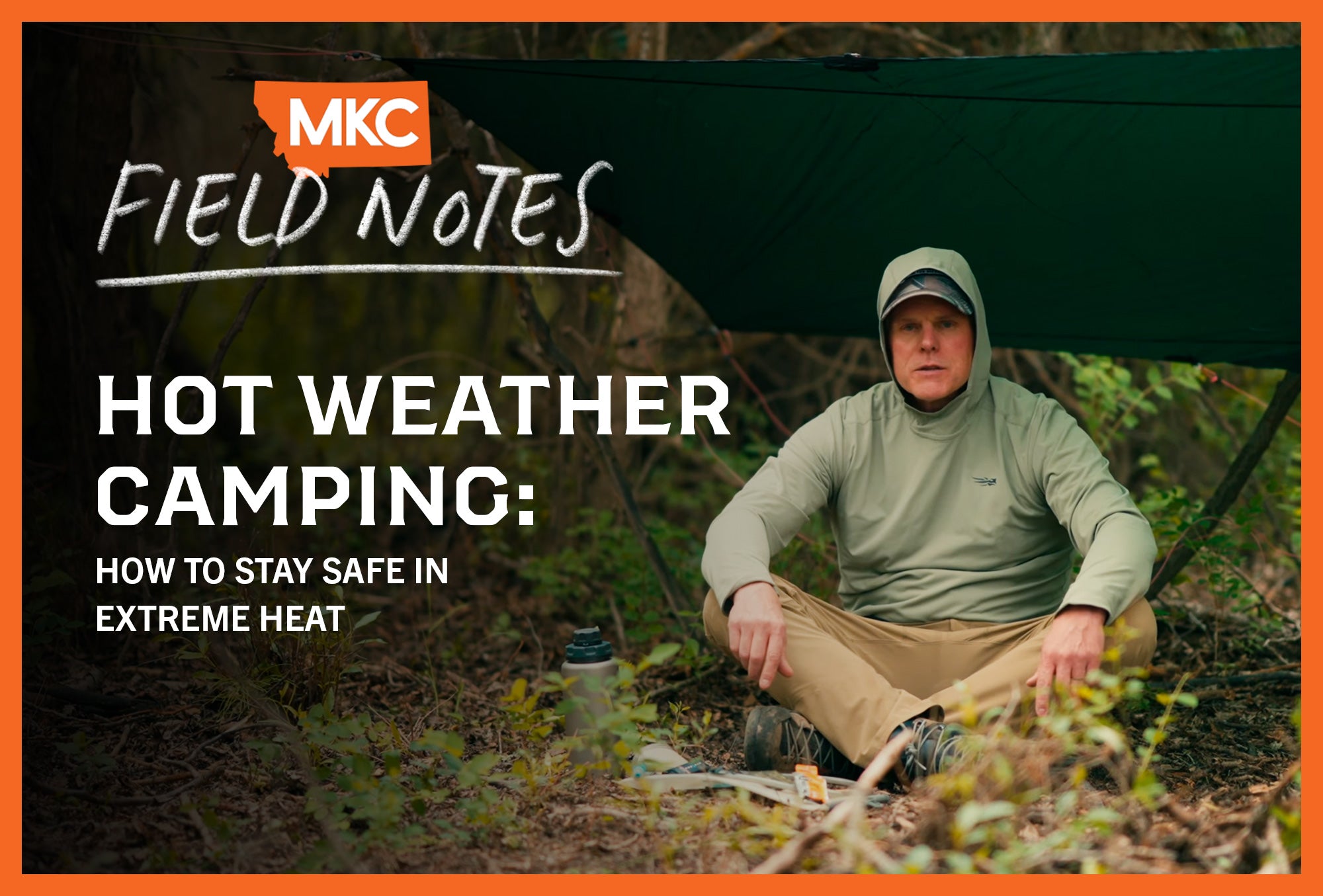 A camper in a light green hoodie sits under tarp in wilderness, seeking shade during extreme heat.