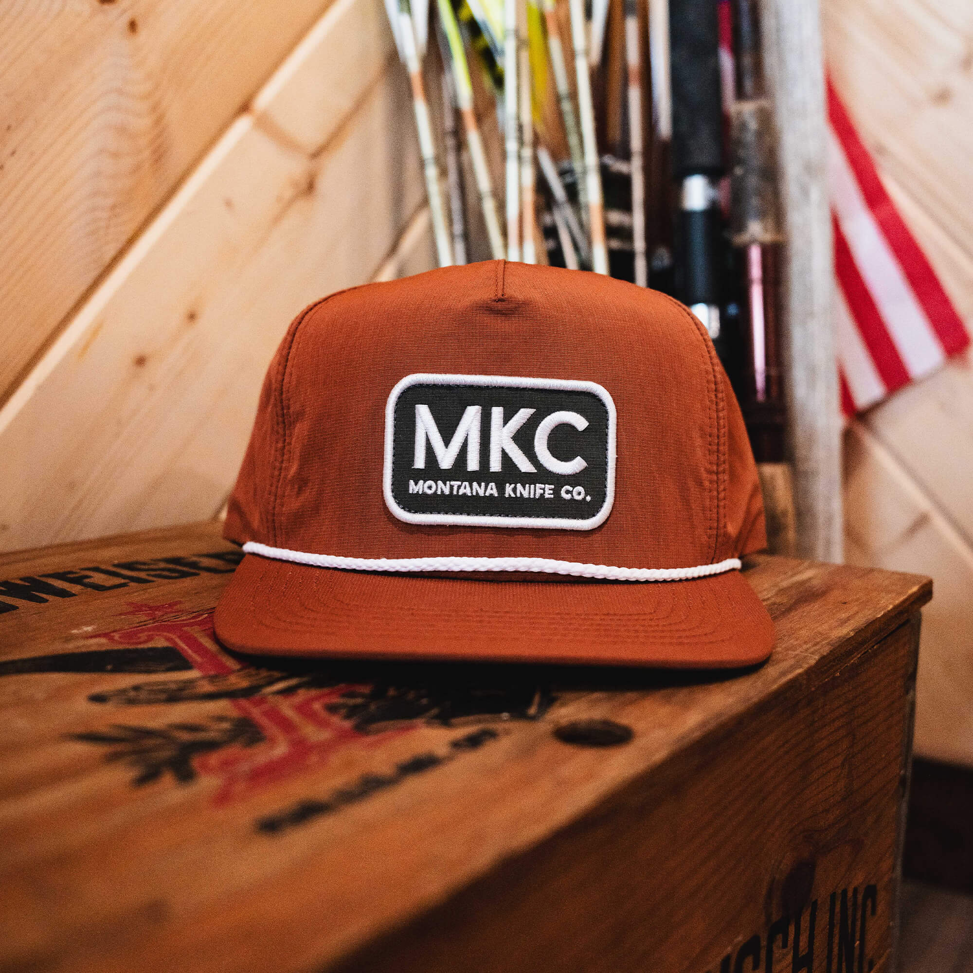 Rust-colored MKC River Rope Hat featuring a logo patch, ideal for outdoor enthusiasts and working professionals.
