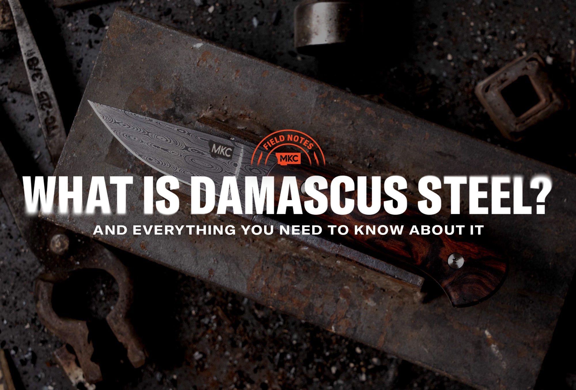 Close‑up of a Damascus steel knife showing its distinctive wavy, patterned blade.