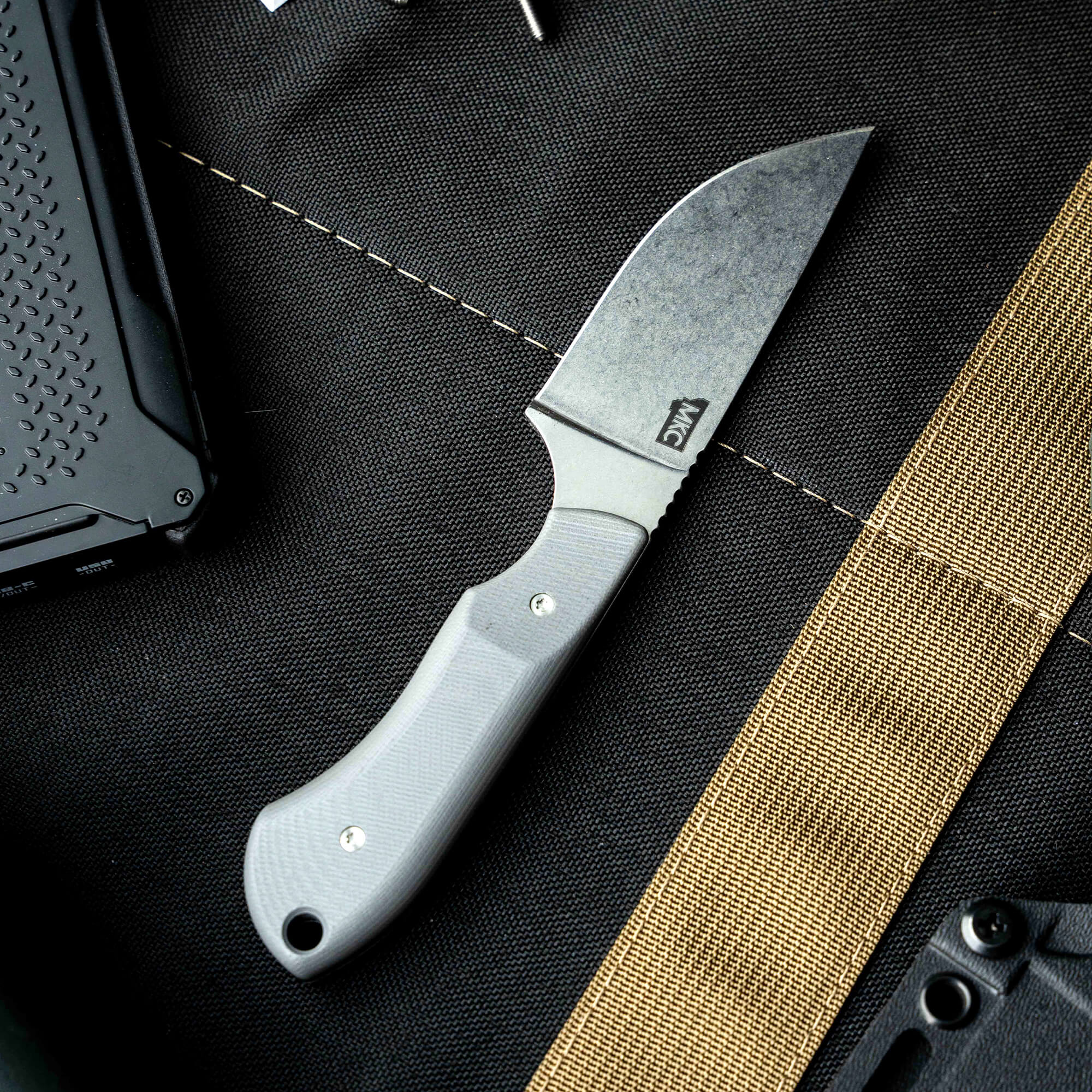 Sleek MKC Elk Knife with a gray handle and a durable blade, designed for outdoor enthusiasts and hunters.