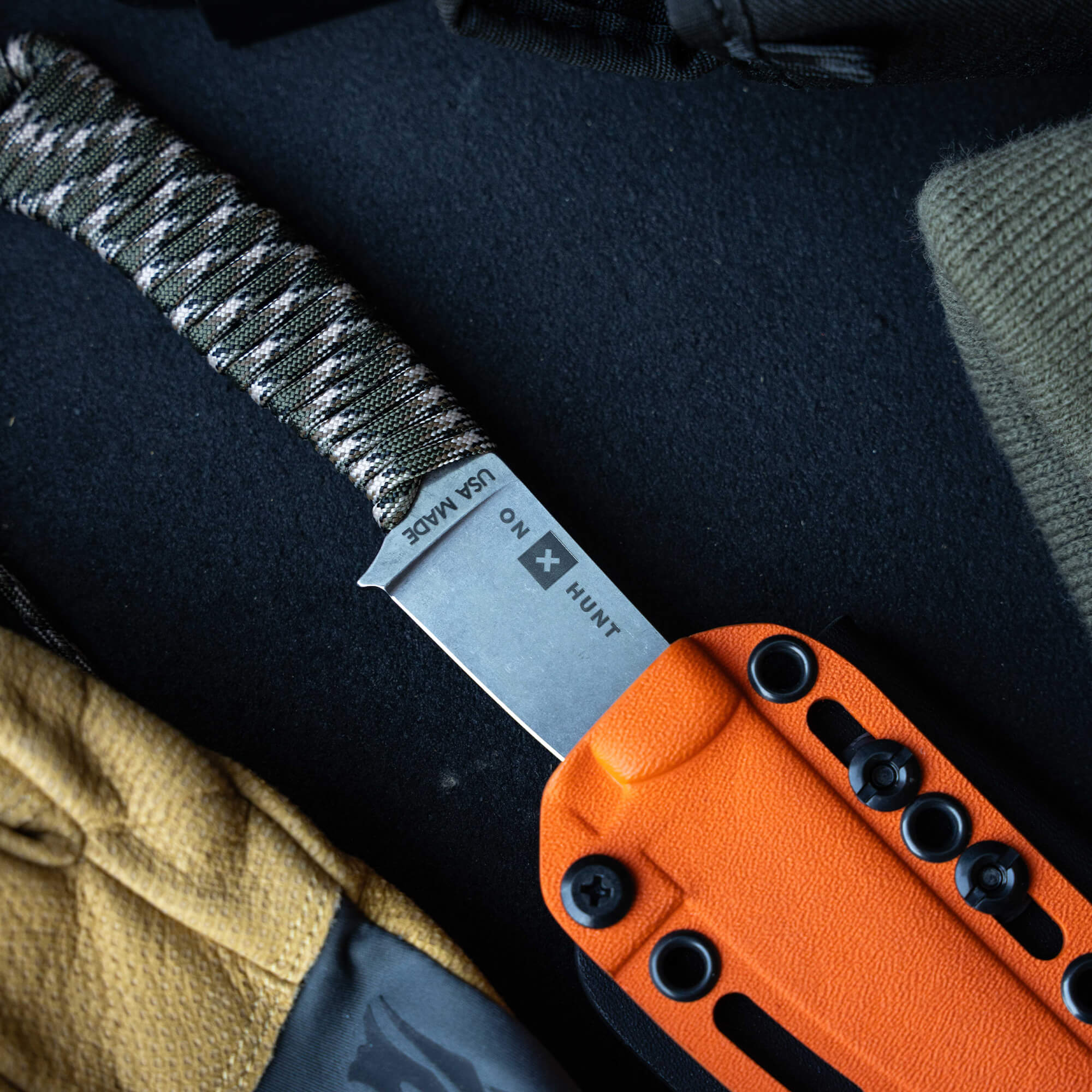 ONX Hunt Magnacut Speedgoat 2.0 knife with orange sheath and textured handle, designed for outdoor and hunting use.