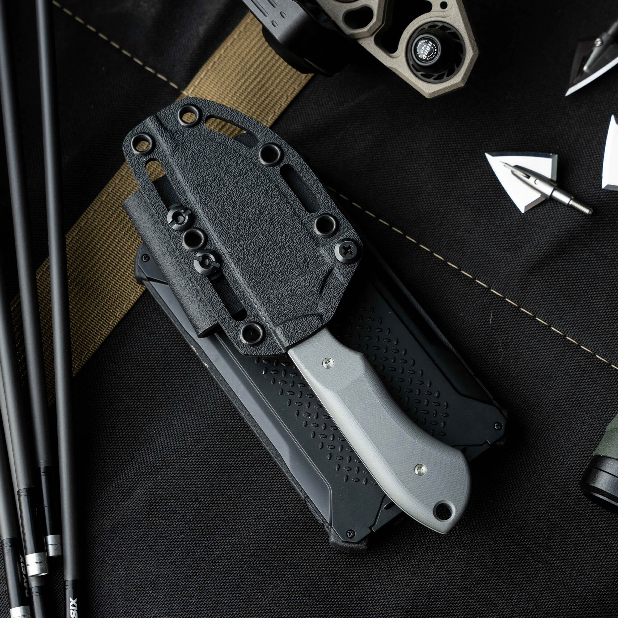 Montana Knife Company's sold-out Live Wild Elk Knife featuring a gray handle and protective sheath, ideal for outdoor enthusiasts.